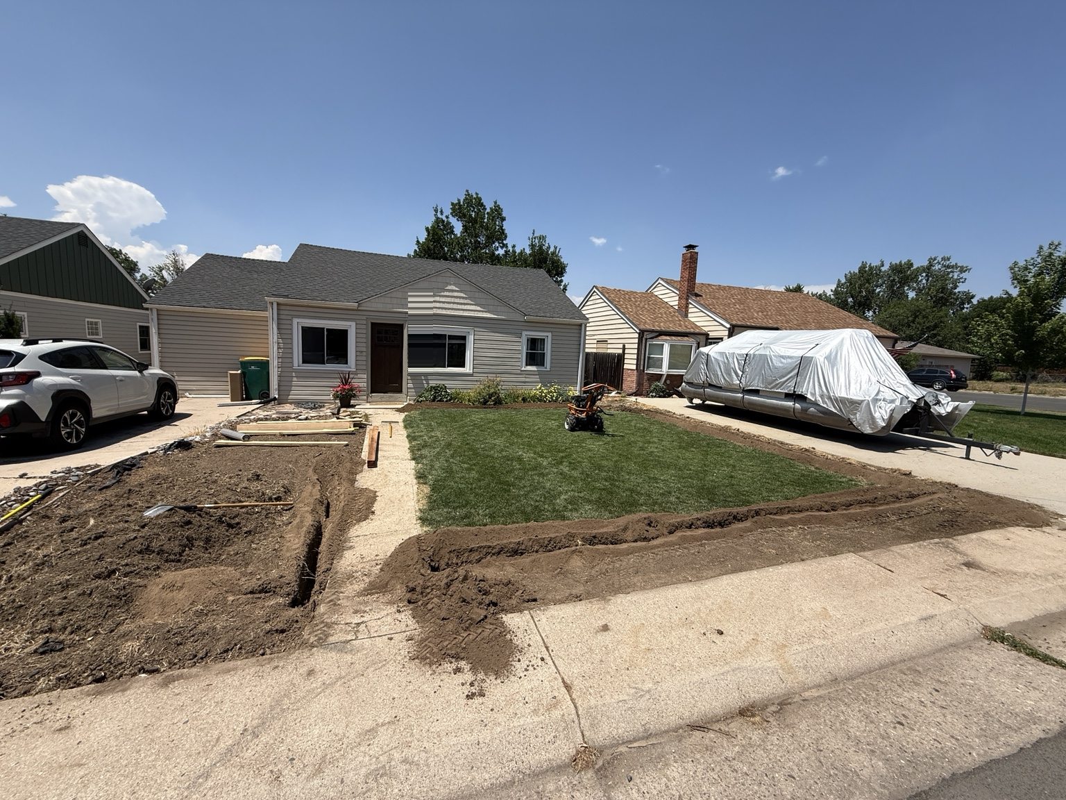 Front-yard trenches laid out along the walk during construction